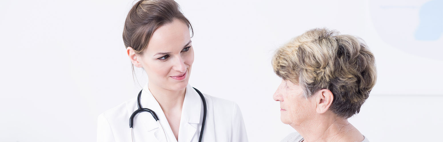 nurse talking with elderly woman